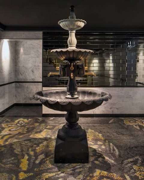 A feature fountain in the restrooms at The bourbon, design by Paul Kelly Design