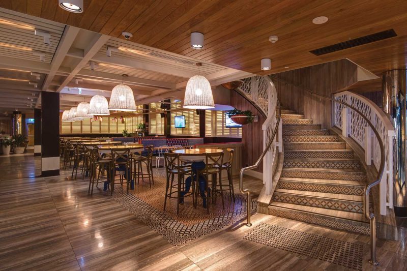 Dramatic stairwell in wide interior photo of The Ivanhoe Hotel by Paul Kelly Design