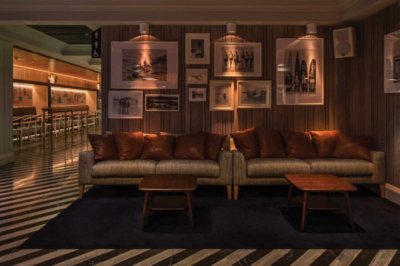 Photograph of sofa with picture arrangement at The Ivanhoe Hotel designed by Paul Kelly Design