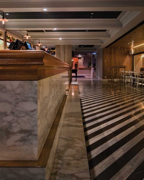 Detail photo of bar and floor at The Ivanhoe Hotel by Paul Kelly Design