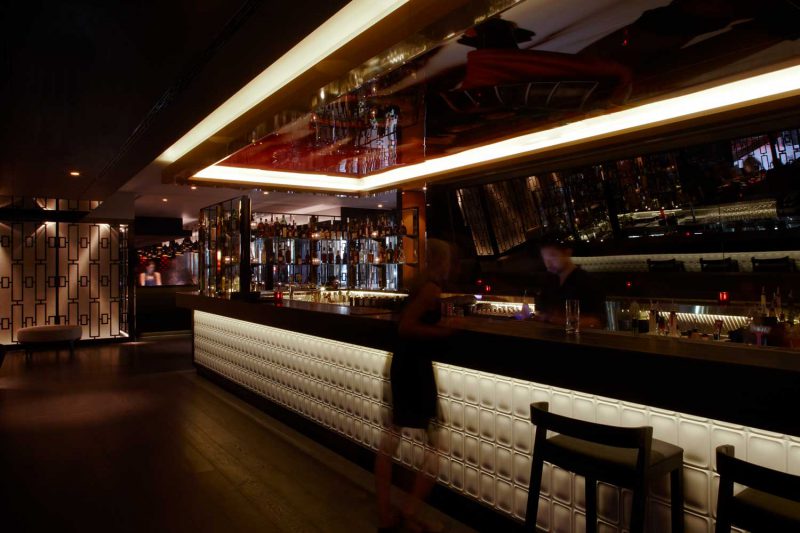 View of the bar at Sokyo with reflective mural on ceiling, design by Paul Kelly Design