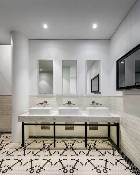 Bathroom featuring beautiful tile work at St Johns Park by Paul Kelly Design
